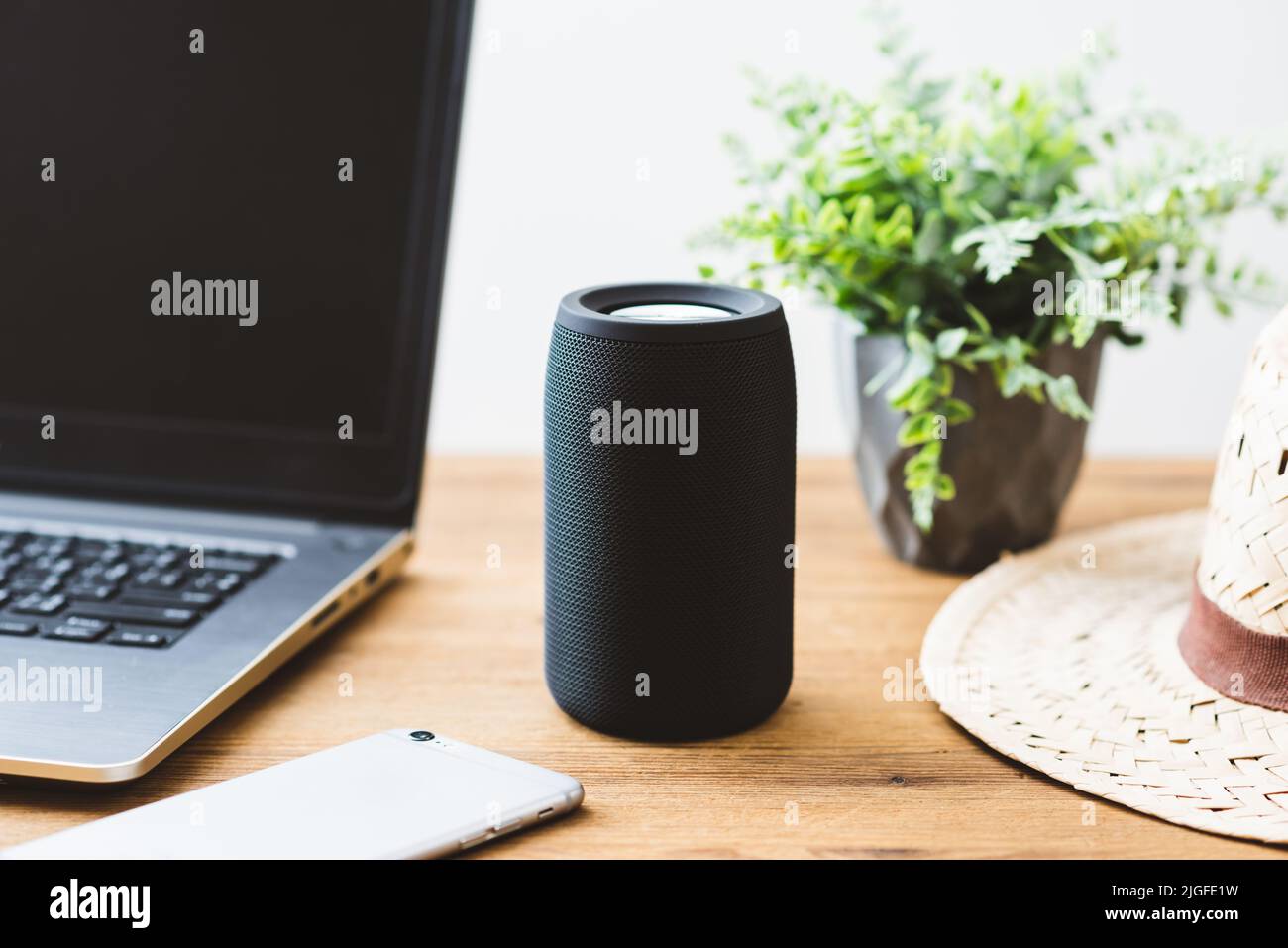 Black mini wireless portable bluetooth speaker for music listening. Stock Photo