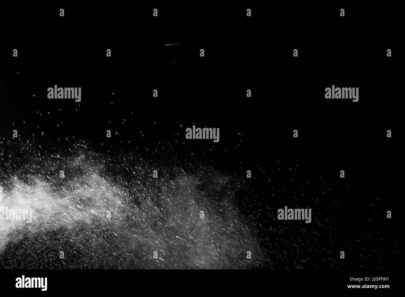 Horizontal steam with drops of spray flying in different directions on a black background for overlay on a photo. Stream, jet of hot water with steam Stock Photo