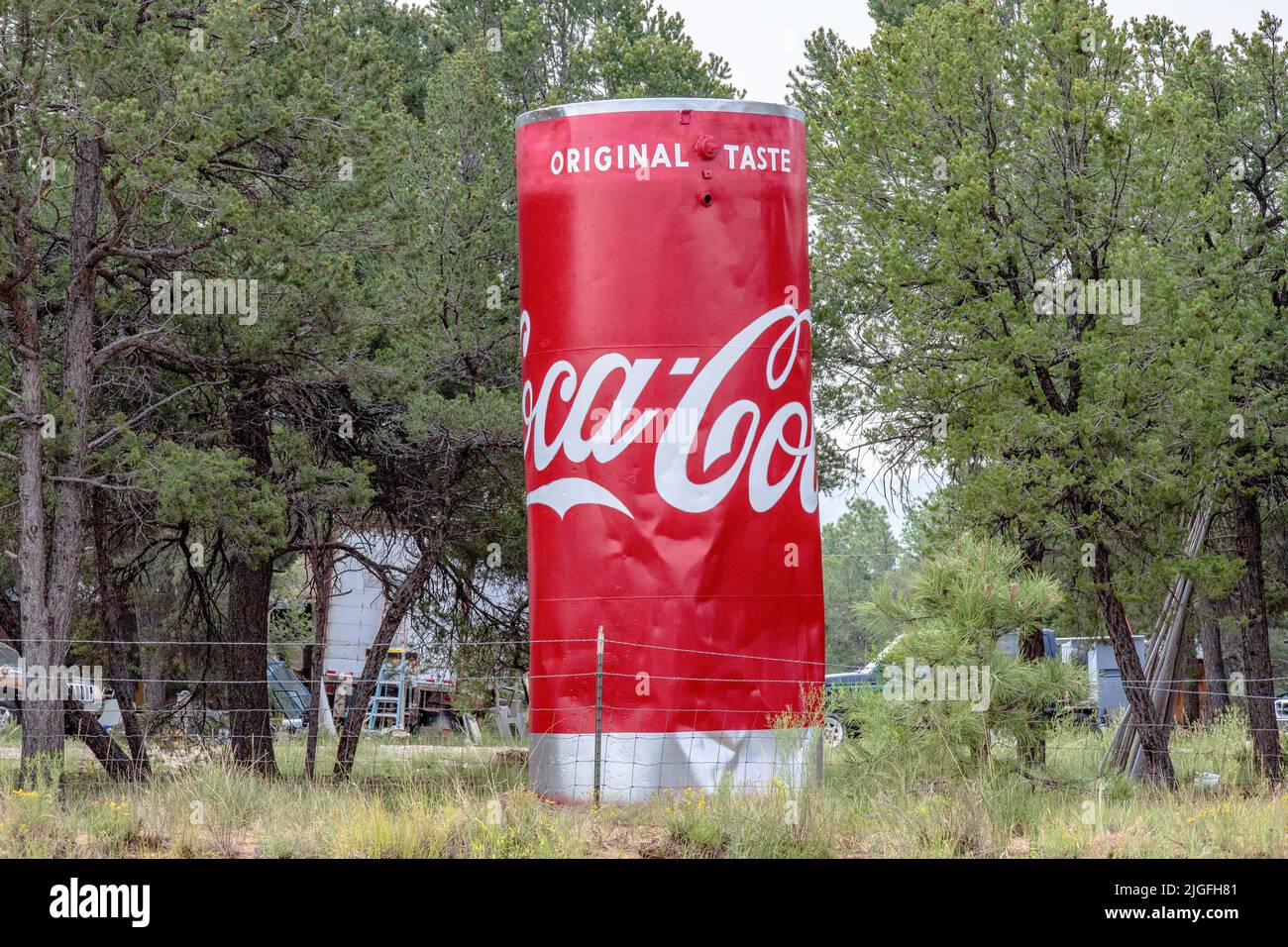 A large Coca Cola advertising sign on the side of the road Pecos in New Mexico Stock Photo