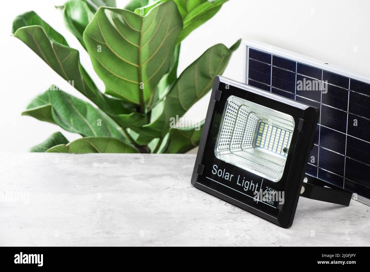LED sport light with solar panel. Energy saving concept. Stock Photo