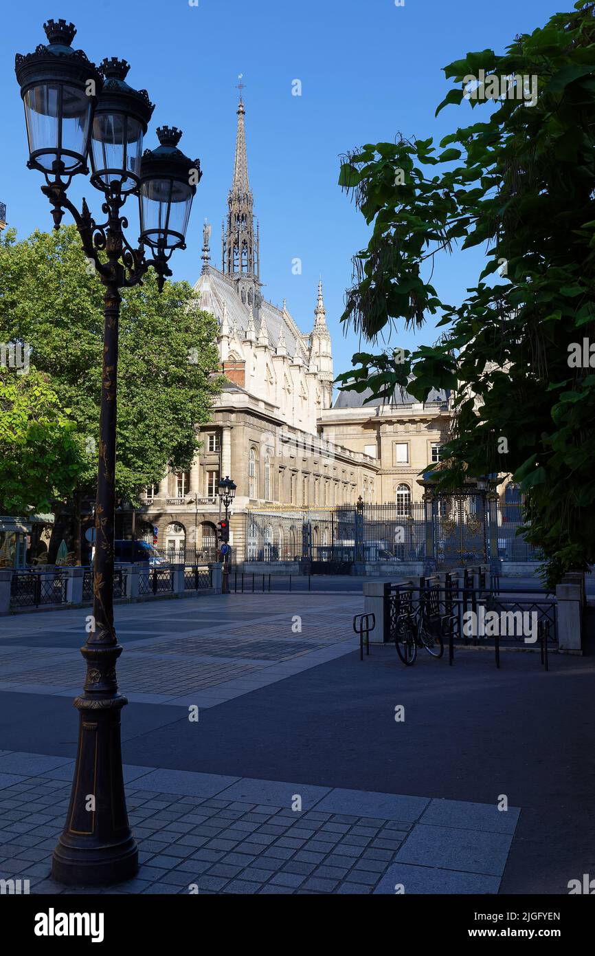 Spire of Saint-Chapelle -Holy Chapel with street lamp in foreground - Paris, France Stock Photo