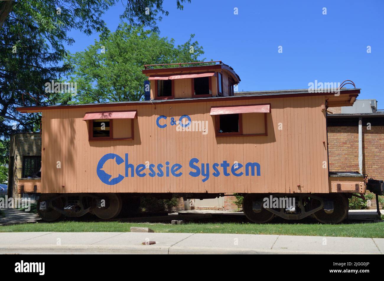 Barrington, Illinois, USA. An old Chesapeake and Ohio Railroad caboose preserved on a parkway in a suburban Chicago community. Stock Photo