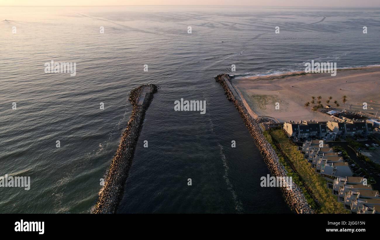 Aerial view of the Manasquan Inlet connecting the Manasquan River to the Atlantic Ocean In Manasquan, NJ Stock Photo