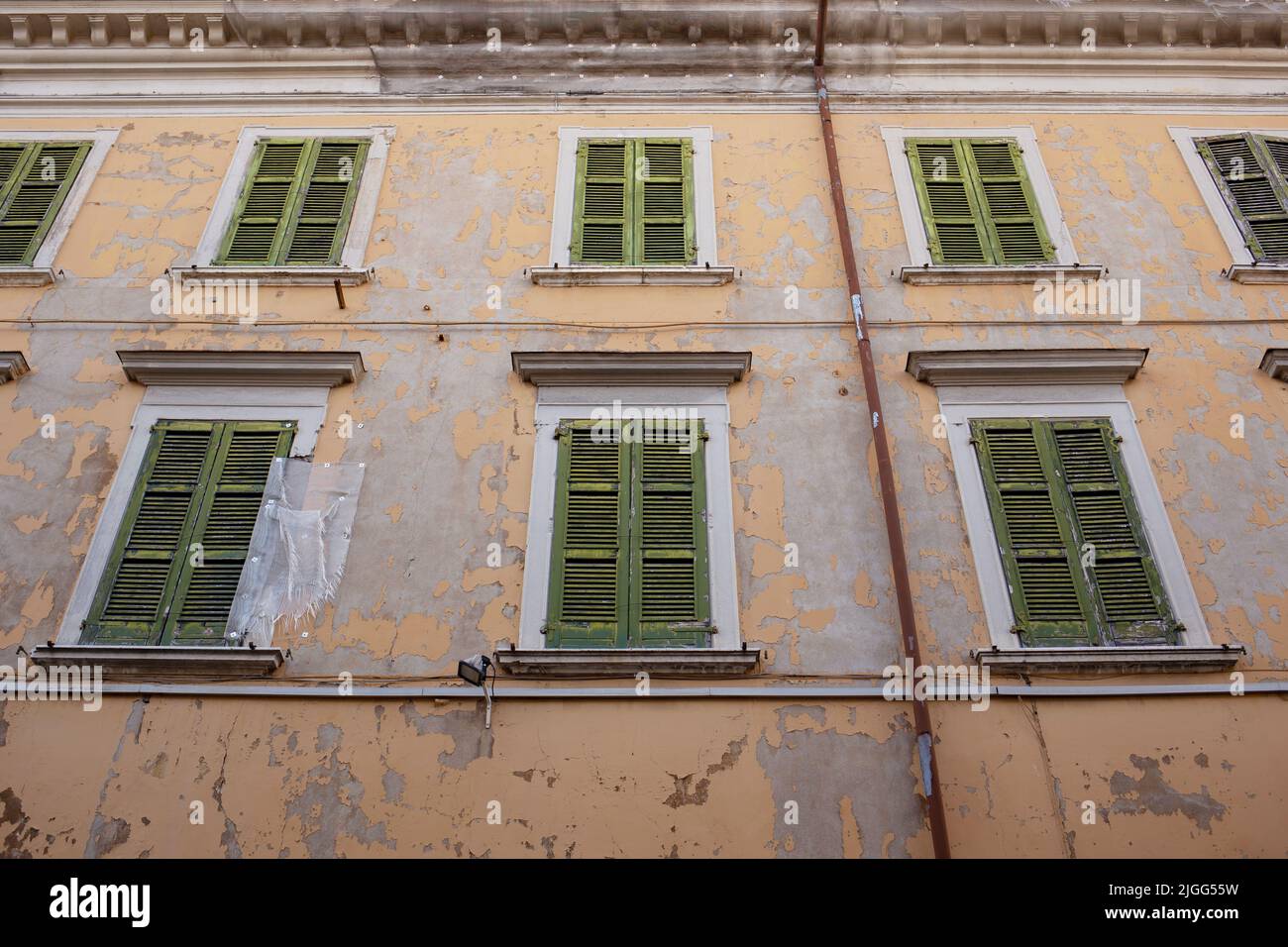 Side of old building with multiple windows, Brescia, Lombardia, Italy Stock Photo