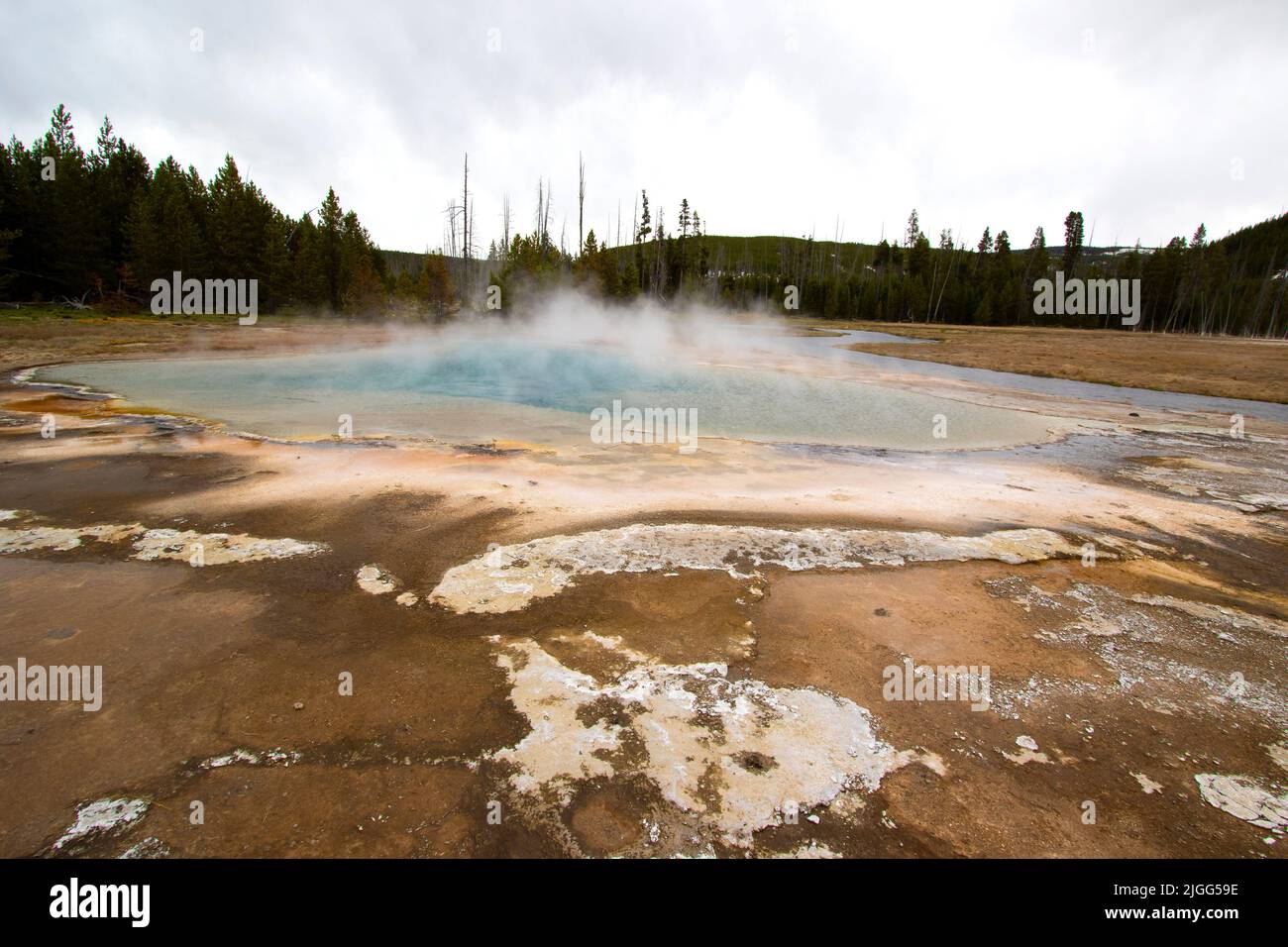 Geothermal Rainbow Pool in the Black Sand Basin of Yellowstone NP, WY, US, May. Stock Photo