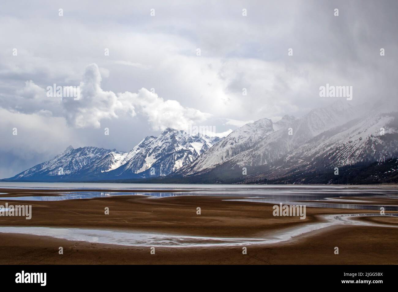 Drought-impacted Jackson Lake and the Teton Mountain Range backdrop at Grand Teton NP, WY, USA> Stock Photo