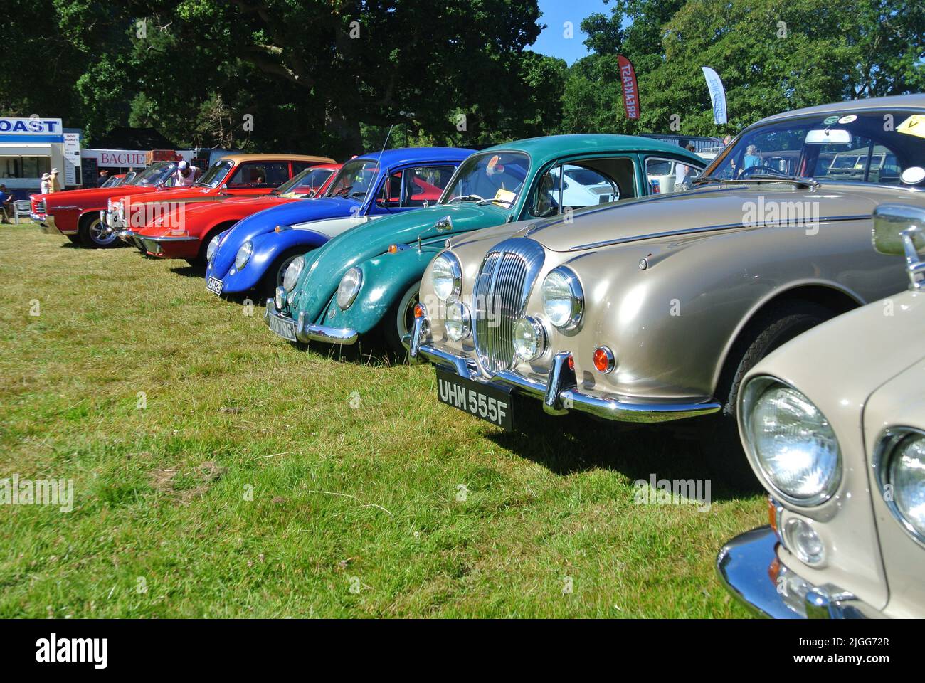 A line of classic cars parked on display at the 47th Historic Vehicle