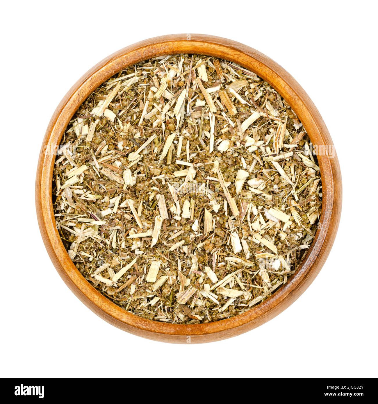 Sweet wormwood, dried herb, Artemisia annua in wooden bowl. The discovery of the plant extract artemisinin is a Nobel prize awarded medication. Stock Photo