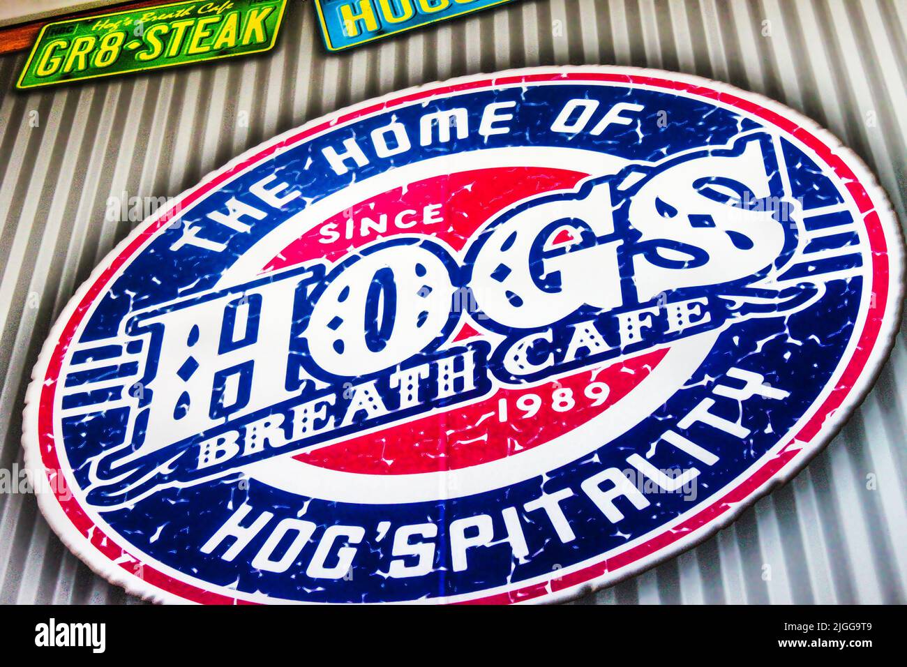 2015-02023 Gold Coast Australia Oval sign for Hogs Breath Cafe on corregated steel wall -Closeup Stock Photo