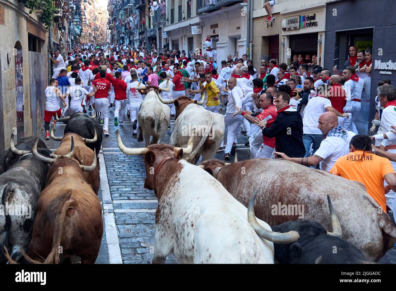 Pamplona, Spain. 10th July, 2022. Crowd of young men run ahead of the bulls  from the livestock of La Palmosilla, in the fourth running of the bulls of  the San Fermin 2022