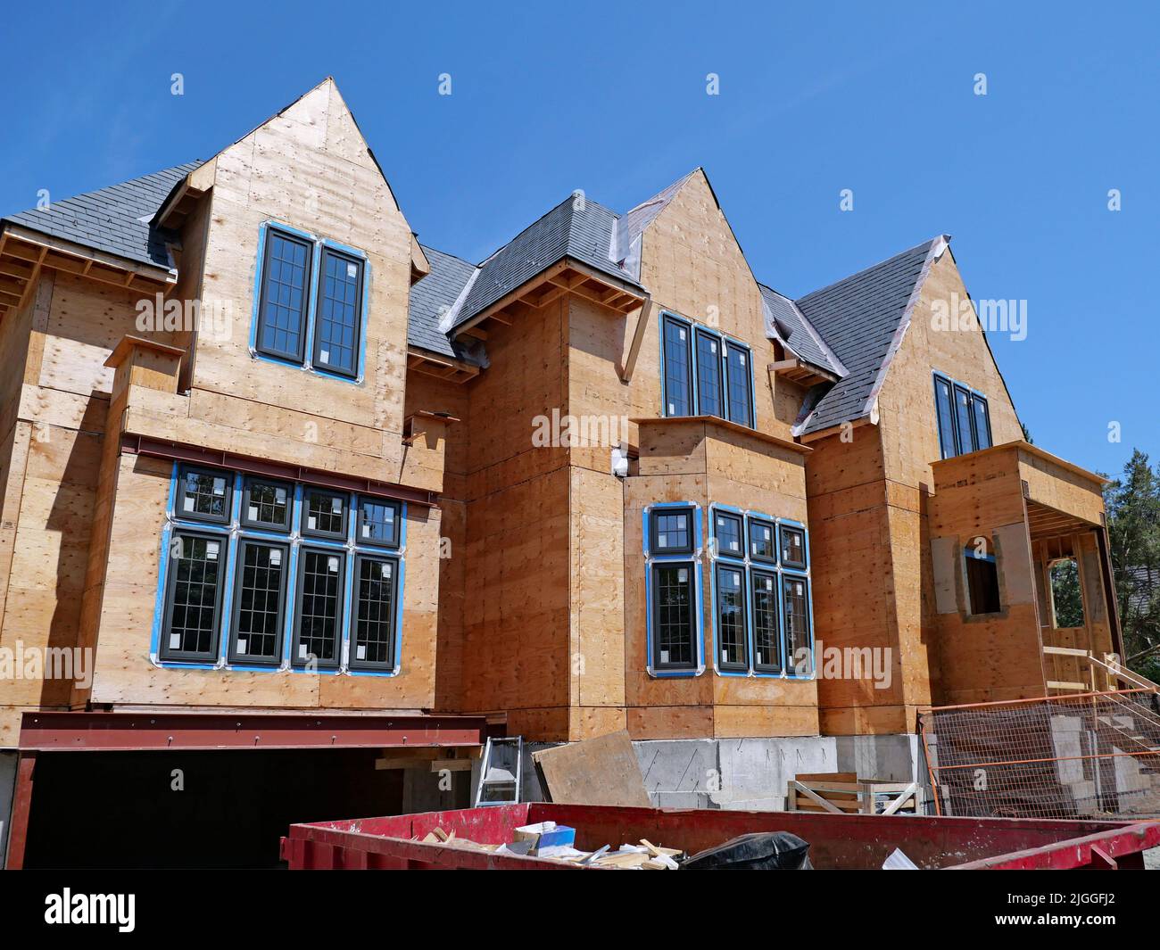 house under construction with plywood exterior cladding not yet covered Stock Photo