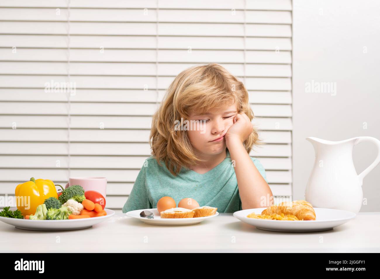 Portrait of kid with no appetite. Concept of loss of appetite. Child