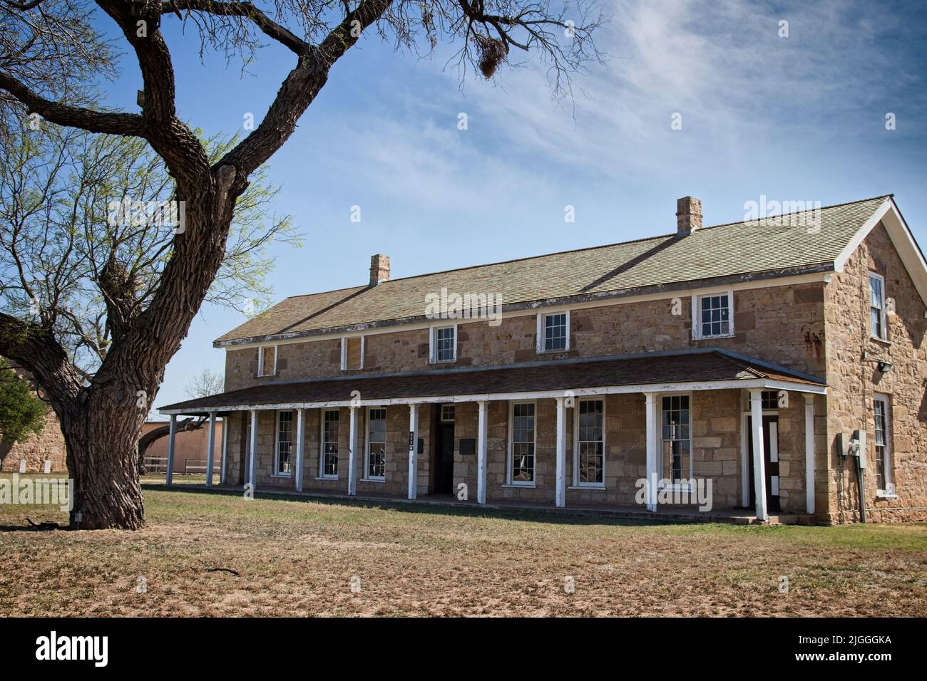 Headquarters at Fort Concho: The photograph includes a prominent tree in front of the Headquarters building at old Fort Concho, in San Angelo, Texas.. Stock Photo