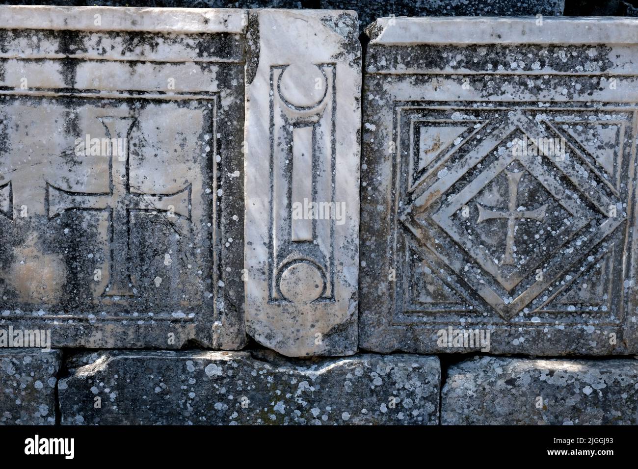 Fragment of stone with symbols at Ephesus in Turkey Stock Photo