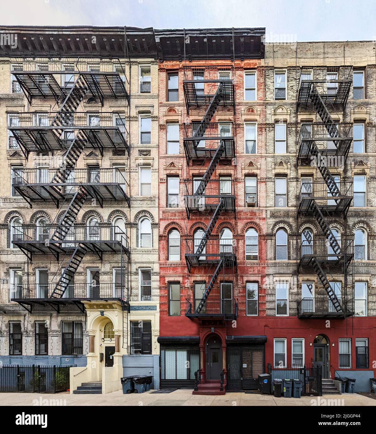 Exterior view of old apartment buildings with fire escapes in the East