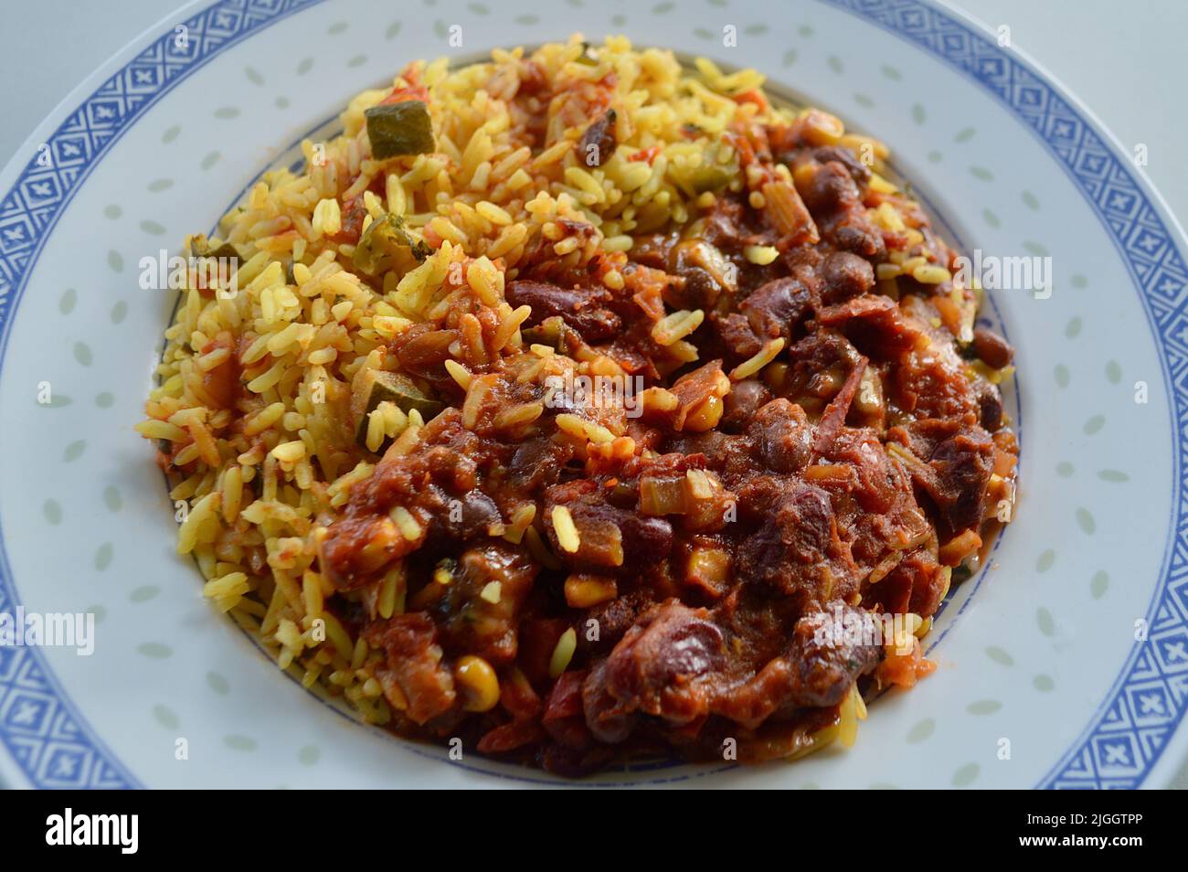 Chili beans and turmeric rice Stock Photo Alamy