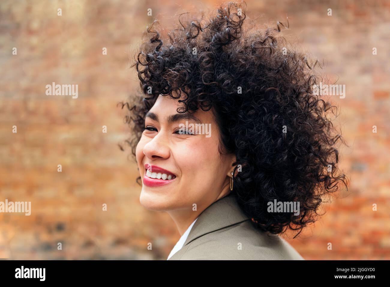 Portrait positive curly woman hi-res stock photography and images - Alamy