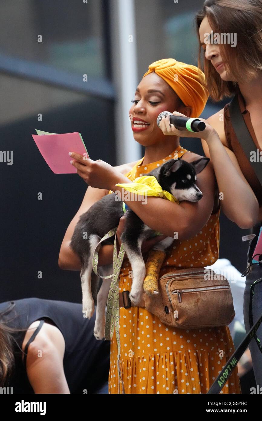 New York, United States. 08th July, 2022. Brittany Johnson and Talia Suskauer (from the musical Wicked) show a puppy for adoption at the Annual Broadway Barks Pet adoption event hosted by Bernadette Peters in Shubert Alley, New York. Credit: SOPA Images Limited/Alamy Live News Stock Photo