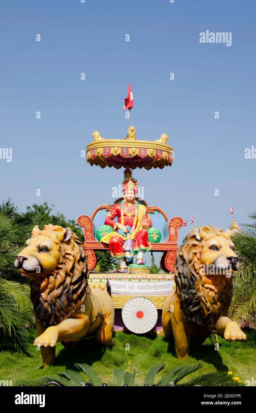 Colourful idol of Bhagwan Shri Swaminarayan at Nilkanthdham, an extensive religious complex with pagodas, fountains, statues & carved idols and gates, Stock Photo