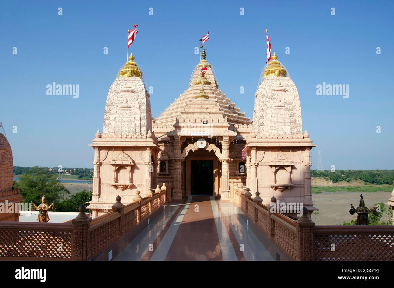Carved temples at Nilkanthdham, an extensive religious complex with pagodas, fountains, statues & carved idols and gates, located at Poicha, Gujarat, Stock Photo