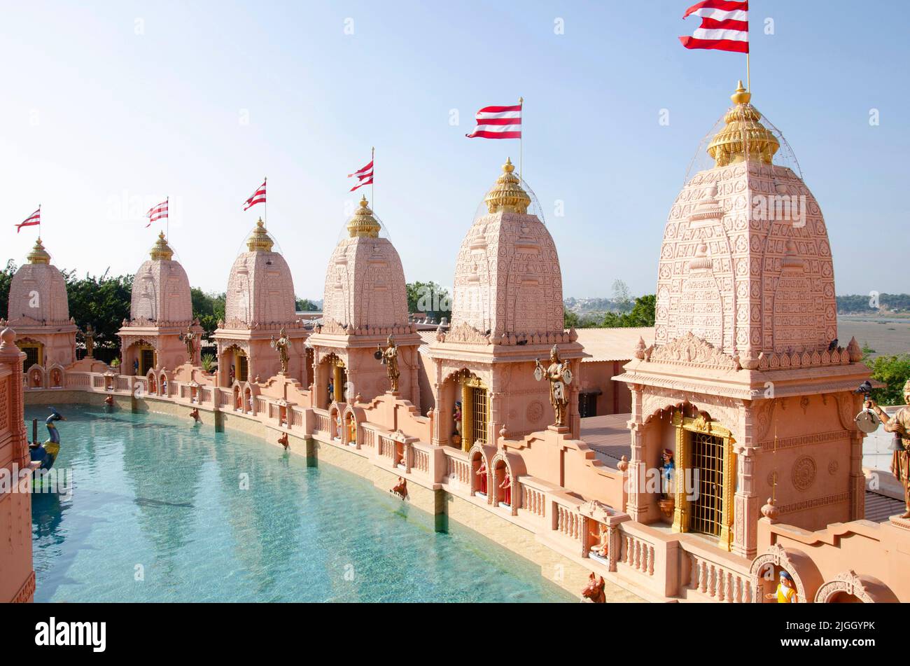 Carved temples at Nilkanthdham, an extensive religious complex with pagodas, fountains, statues & carved idols and gates, located at Poicha, Gujarat, Stock Photo