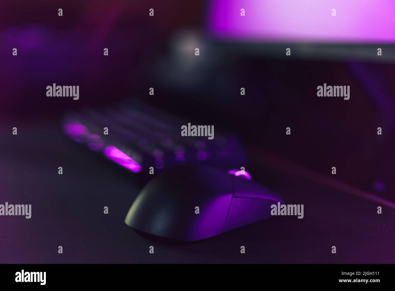 Gaming accessories on neon purple background Stock Photo