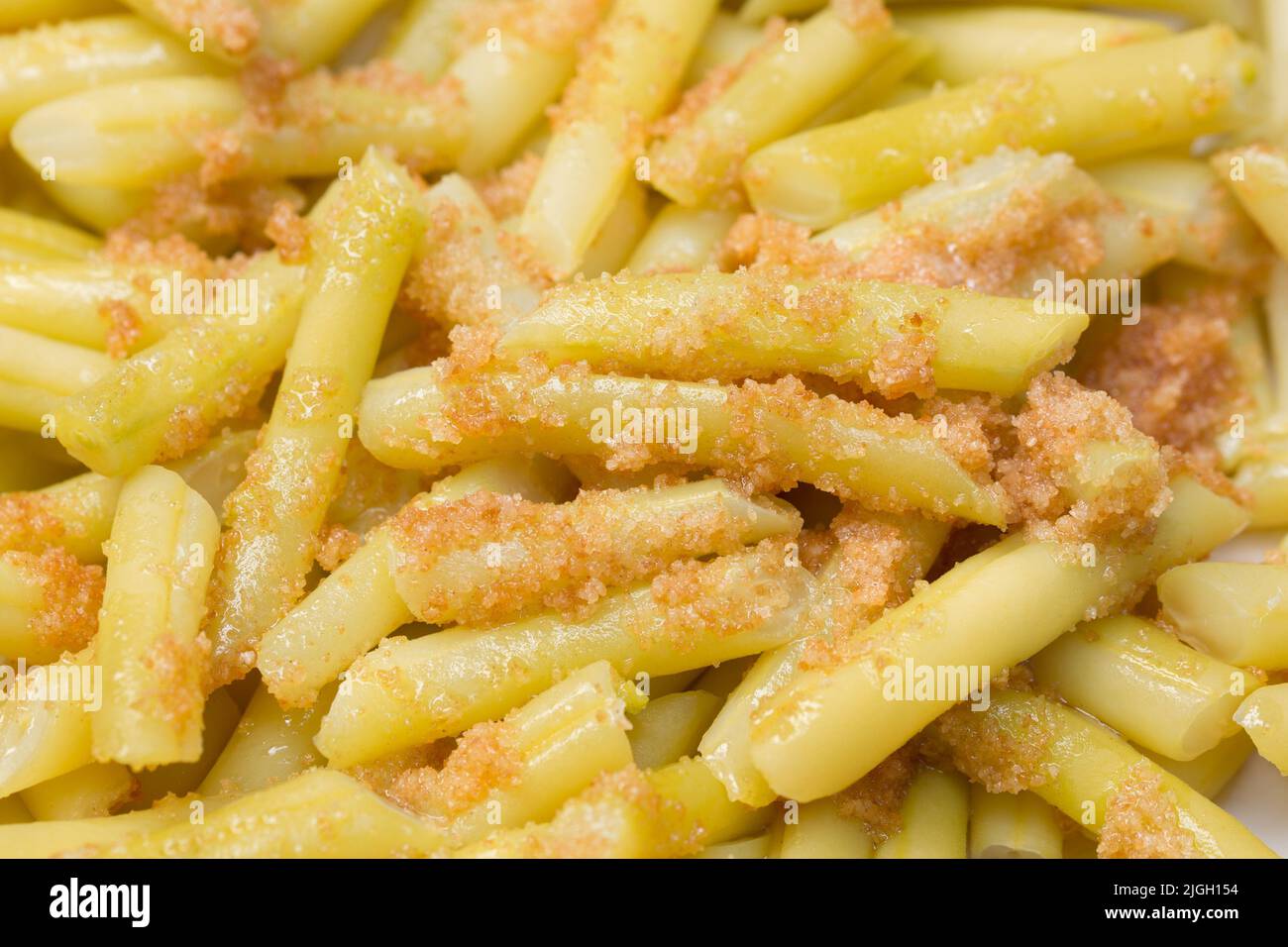 yellow vax beans with fried bread crumbs sauce closeup selective focus Stock Photo