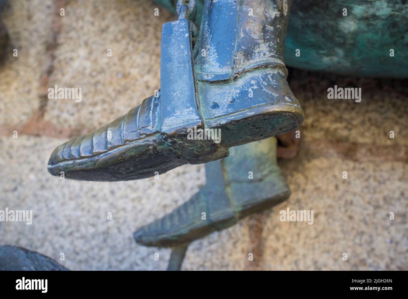 Feet in stirrup of Saint George. Bronze sculpture at Caceres, Spain Stock Photo