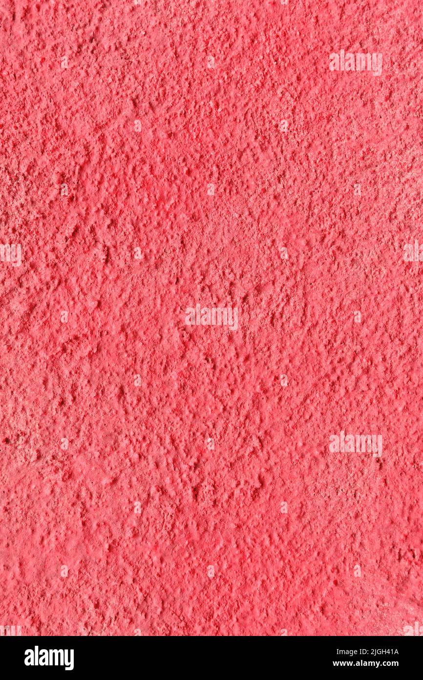a concrete wall painted with red spray paint Stock Photo