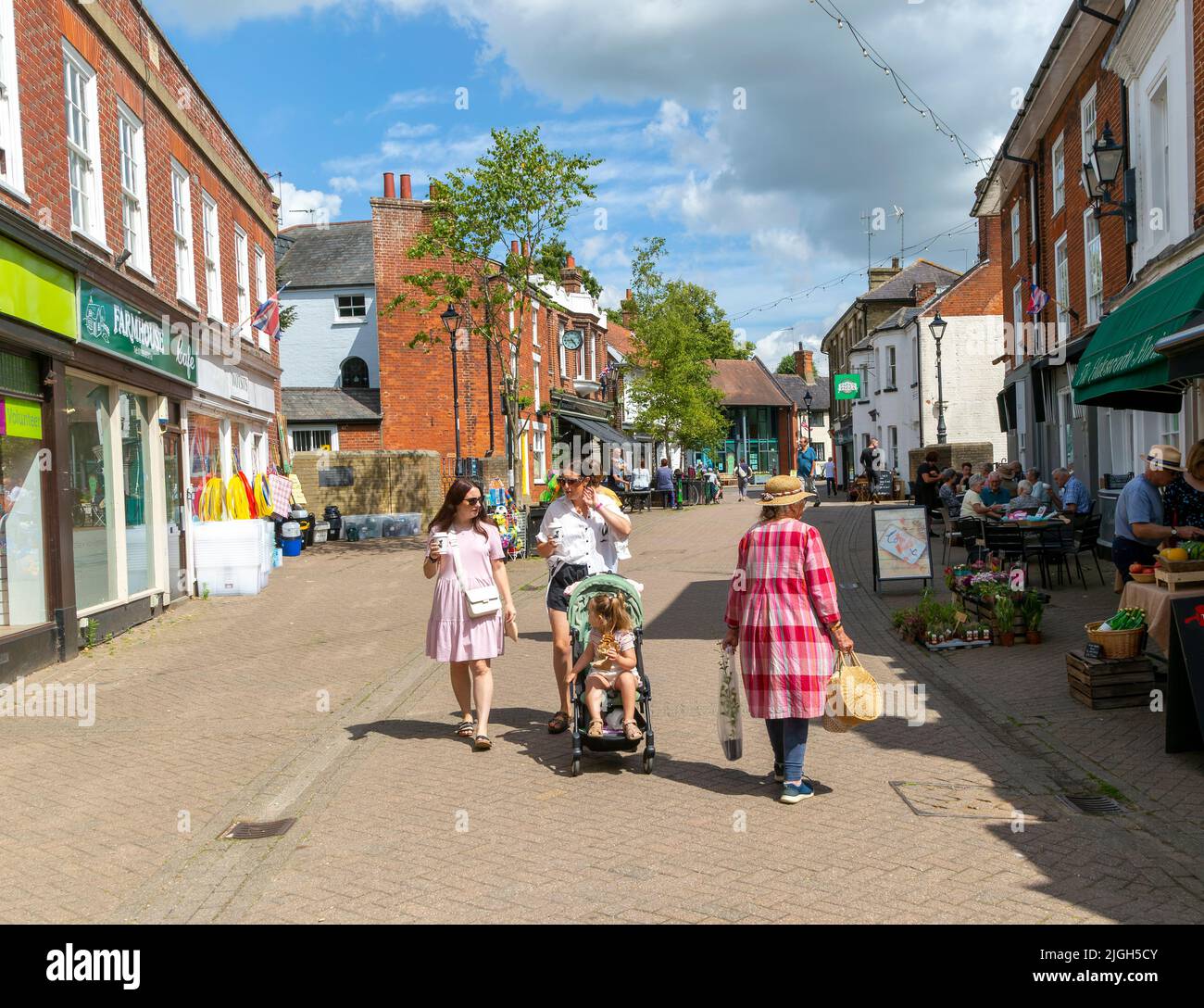People shopping in pedestrianised street, The Thouroughfare, Halesworth, Suffolk, England, UK Stock Photo