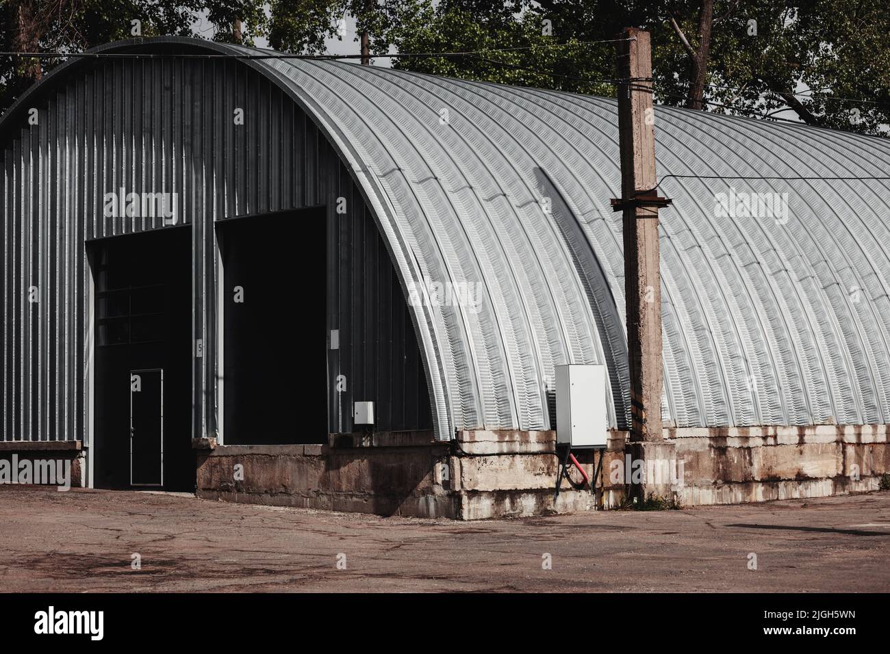 Metal hangar oval shape. storage construction. steel warehouse Stock Photo