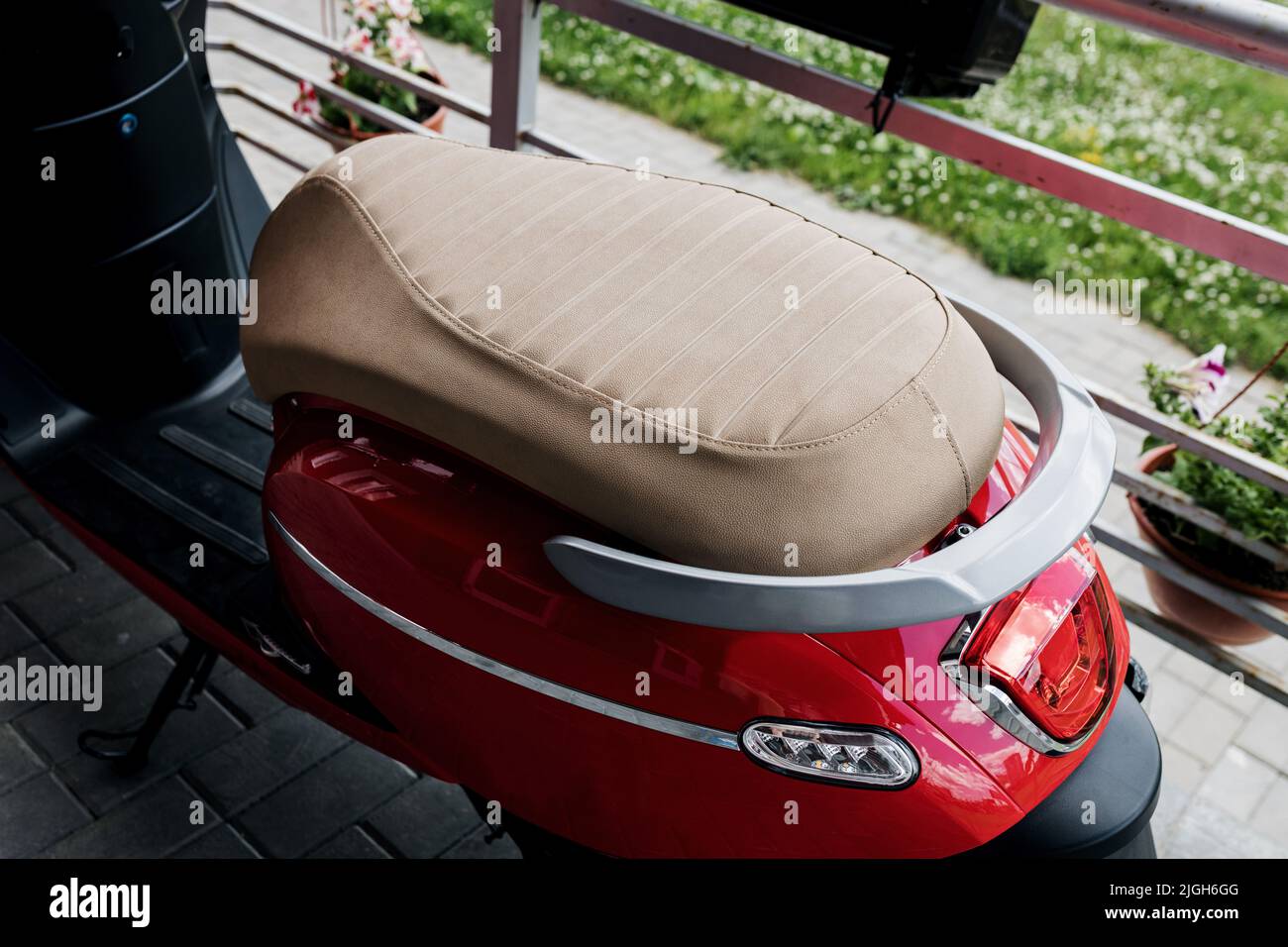 the seat of a red vintage moped. mobile vehicle. european scooter Stock