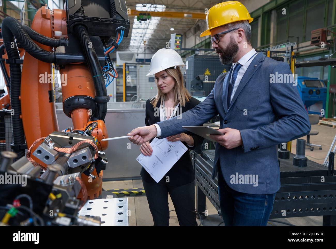 Female engineering manager and mechanic worker doing routine check up