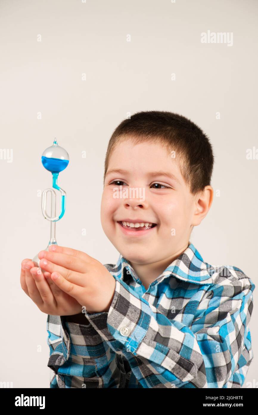 a-4-year-old-boy-is-studying-chemistry-holding-in-his-hand-a-flask