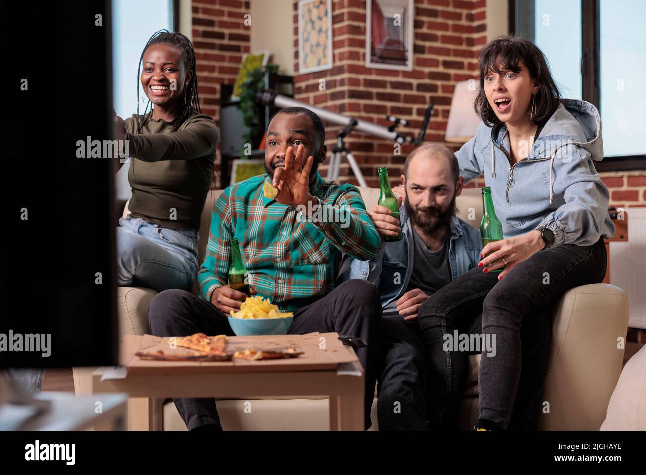 Group of supporters watching football game tournament on sport tv