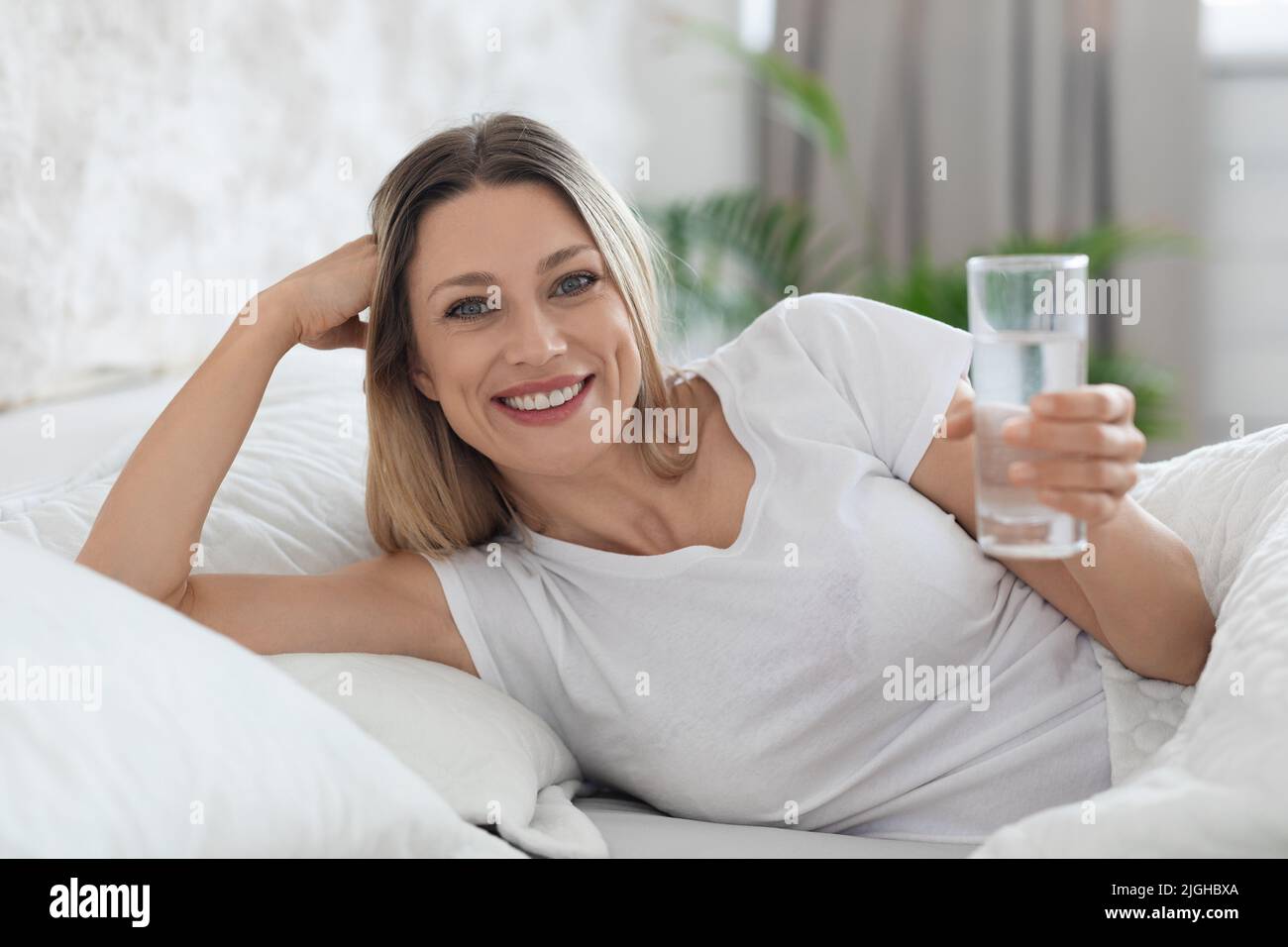 Young woman lying in water hi-res stock photography and images - Alamy