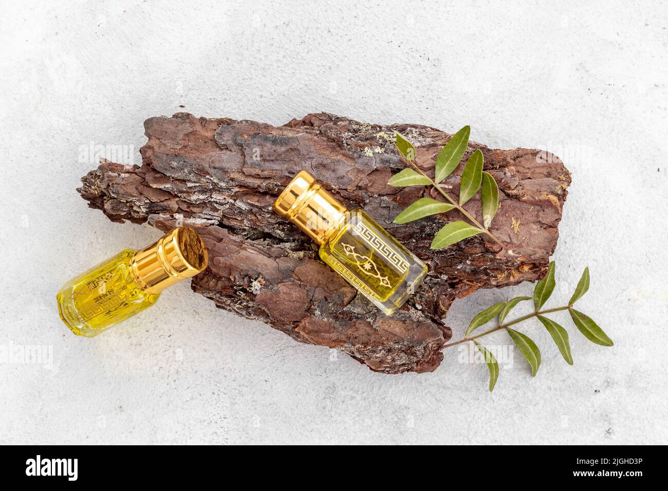 Arabian oud attar perfume essential oil in glass bottles, top view