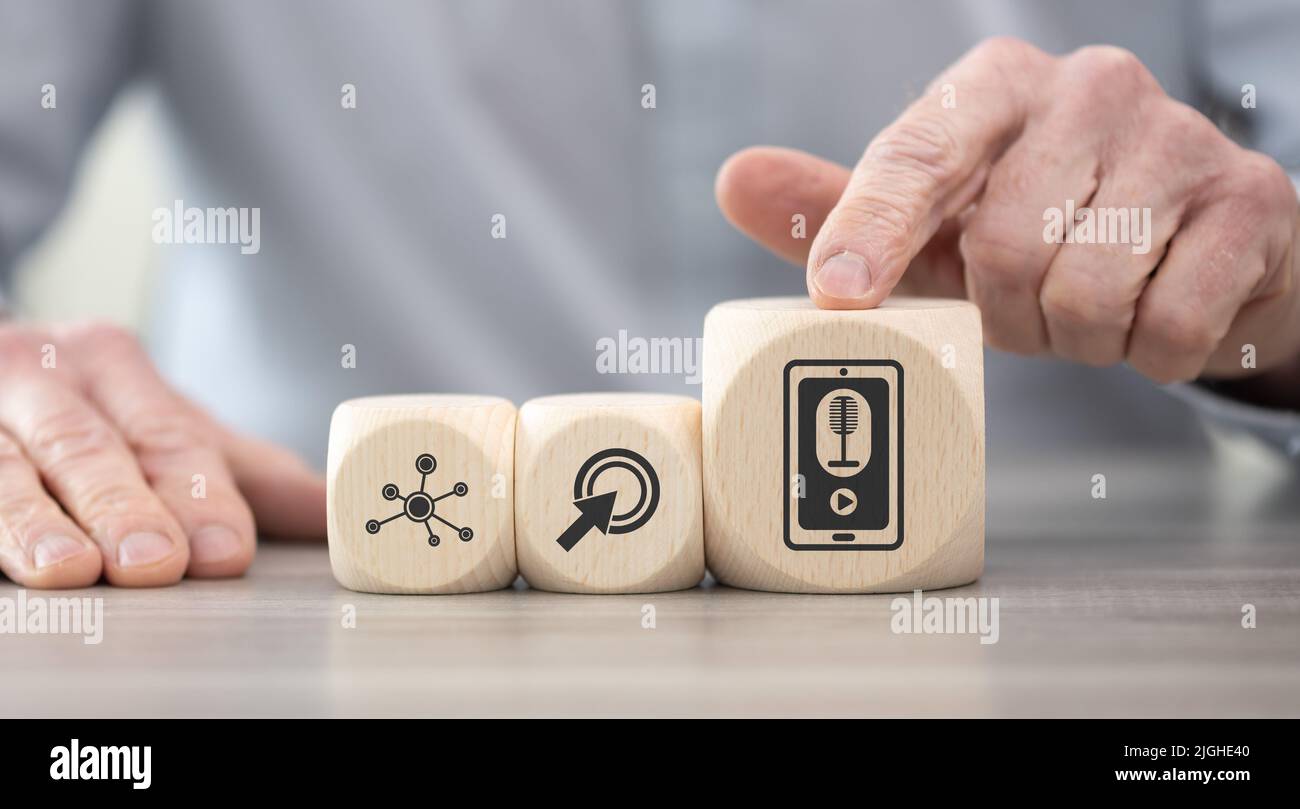 Wooden blocks with symbol of podcast concept Stock Photo Alamy