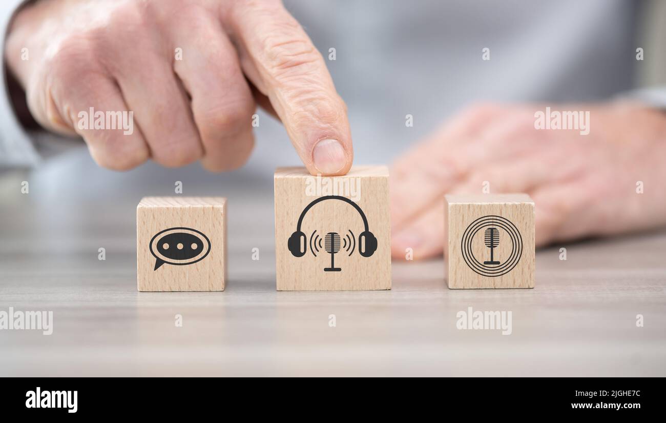 Wooden blocks with symbol of podcast concept Stock Photo Alamy