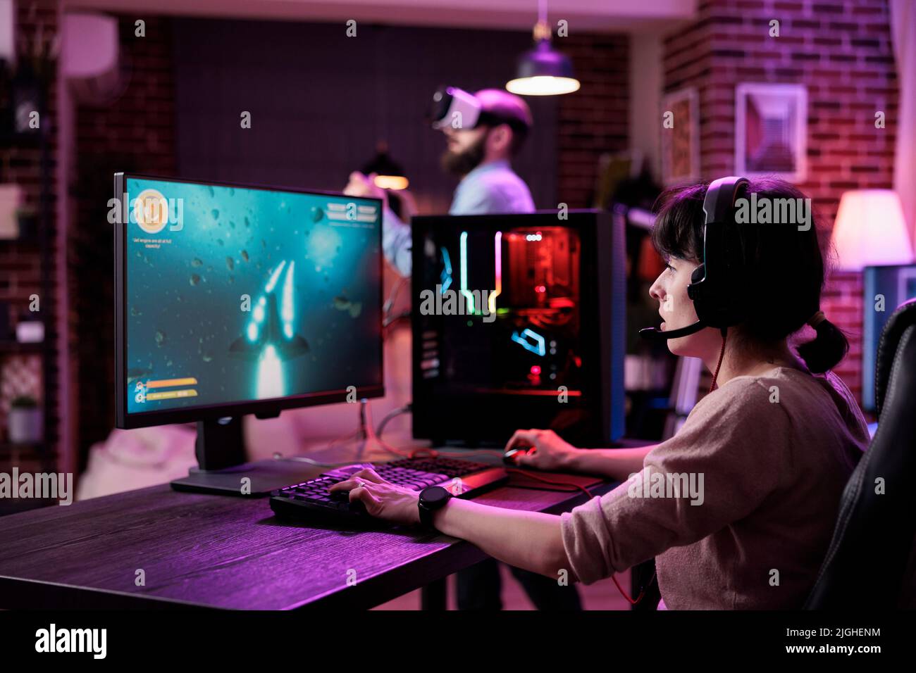 Esport of pro gamer playing video game with new graphics winning  championship, stylish design cyber games room. Virtual shooter game in  cyberspace, esports player performing on pc gaming tournament Stock Photo