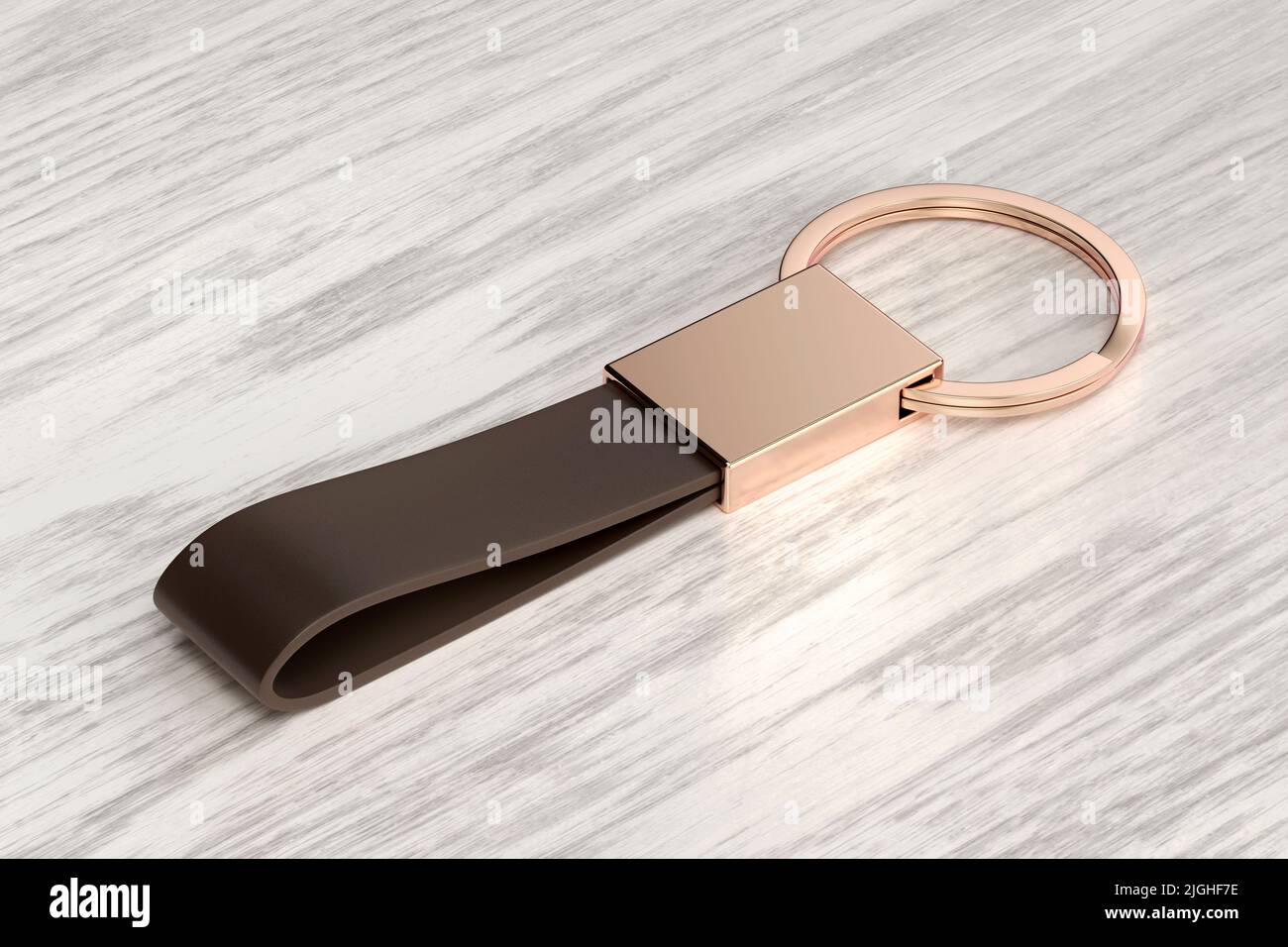 Luxury keychain with leather strap on wooden desk Stock Photo Alamy