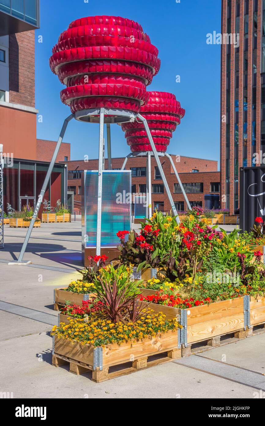 Flowers and art in front of the Dortmunder U building in Dortmund, Germany Stock Photo