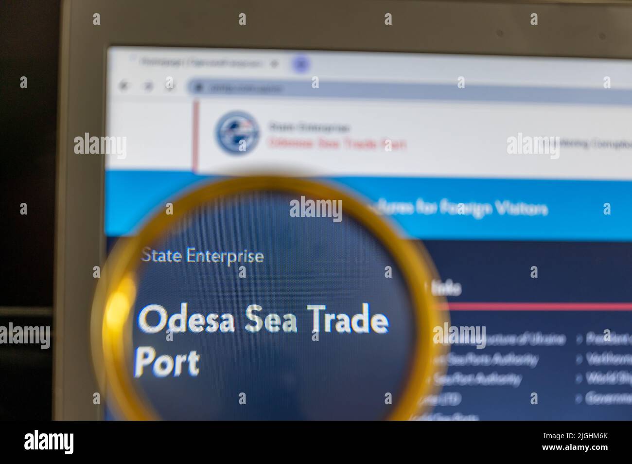 Home page of the Odessa Commercial Seaport on the laptop screen. The