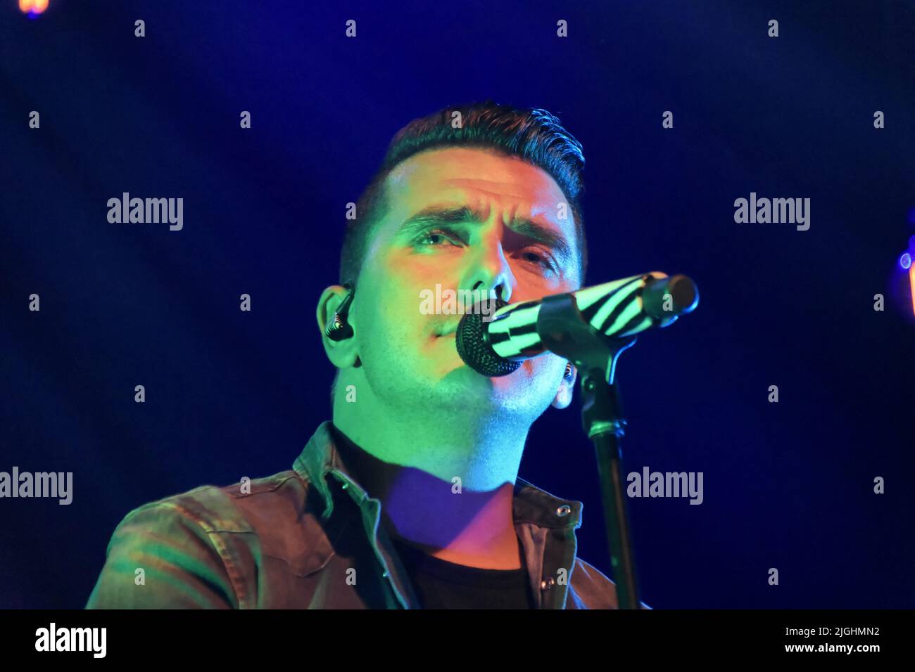 A closeup of Jan Smit performing at a concert in Steenwijk, The Netherlands Stock Photo