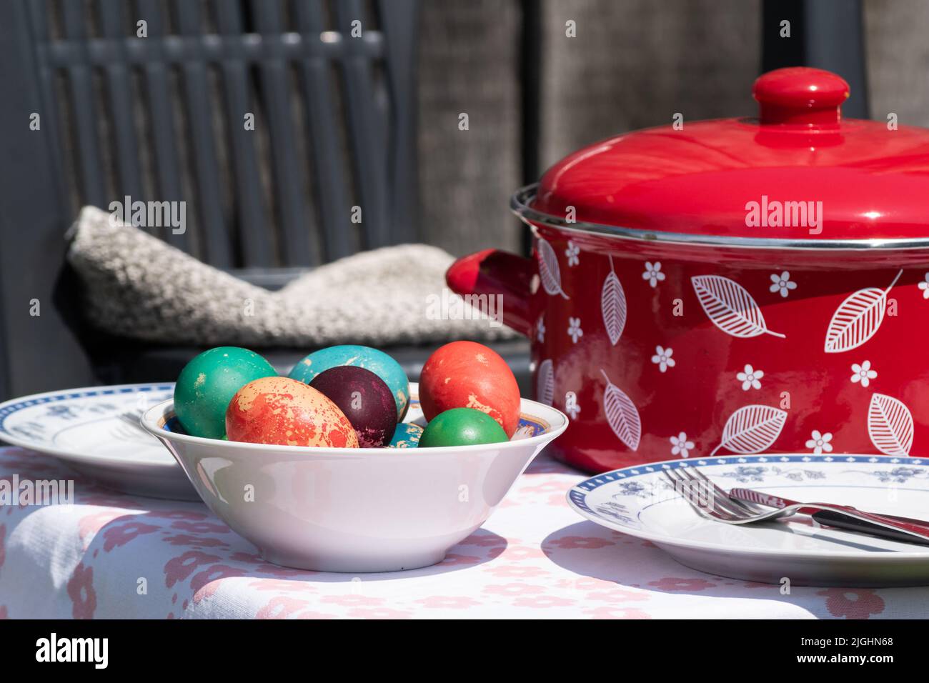Easter eggs in ceramic bowl on table, colourful eggs for christian feast Easter Stock Photo