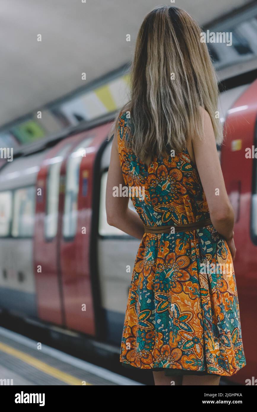 Woman waiting for the train hi-res stock photography and images - Alamy