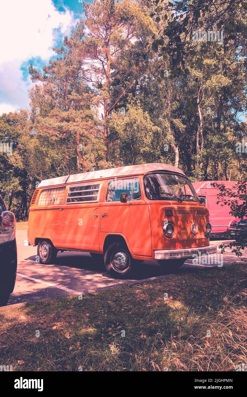 The vintage orange Volkswagen camper T2 bus Stock Photo