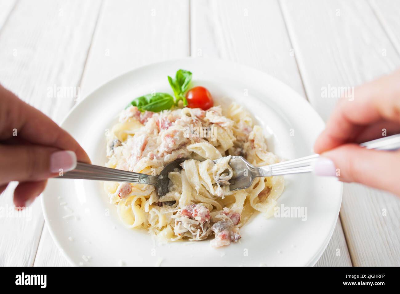 Traditional eating of pasta carbonara, eater pov Stock Photo Alamy