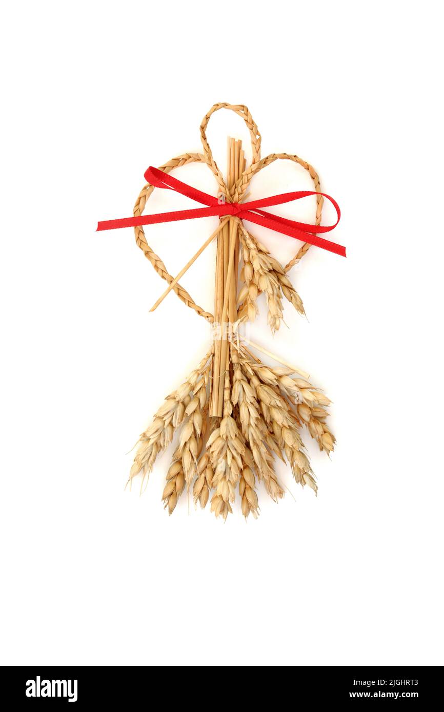 Sweetheart style corn husk doll  for lovers. Pagan wicca symbol of fertility for success. Traditional old fashioned  bountiful harvest concept. Stock Photo