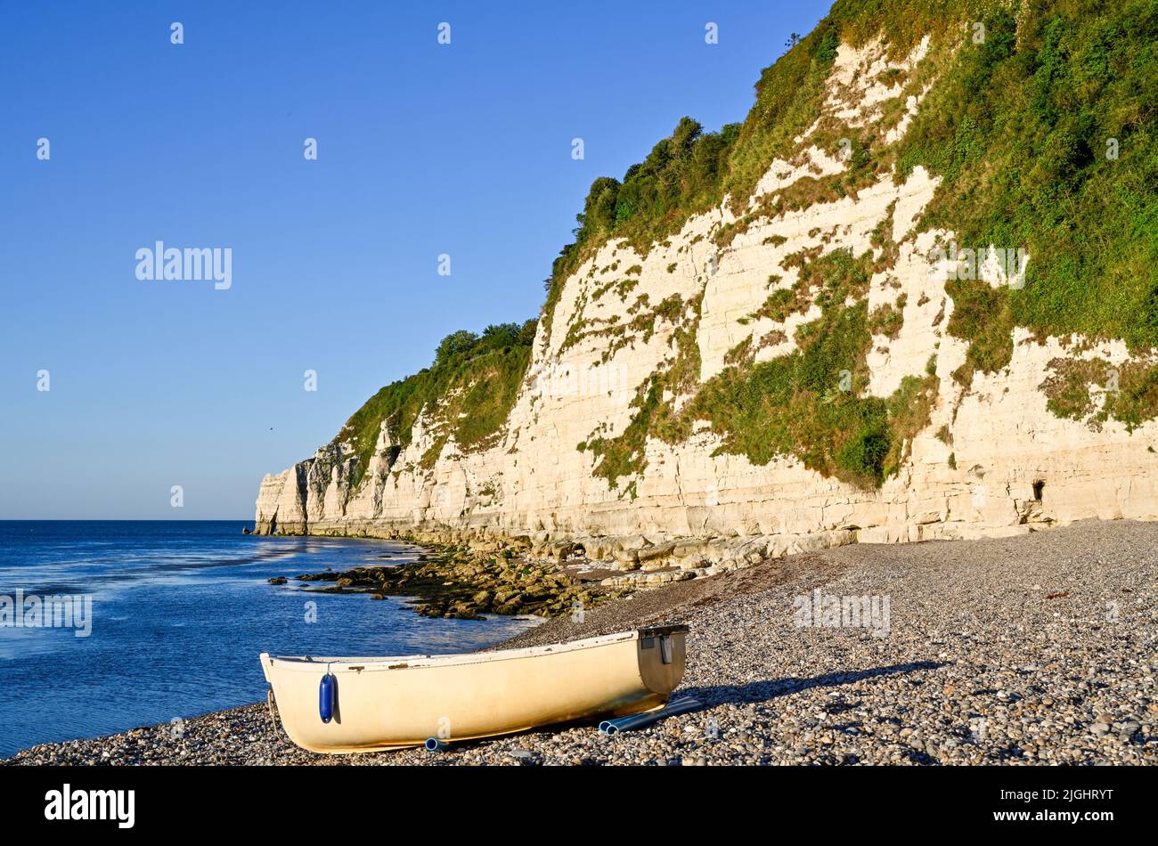 Devon Beer Beach and Rowing Boat Summer Stock Photo